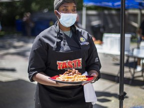 Danielle Martin bring out her macaroni and cheese with seared chicken dish during a food competition organized by the Frontburners free training program for youths ages 18 to 29 at the Frontlines youth centre on Weston Rd. in Toronto, Ont. on Saturday, Aug.14, 2021.