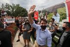 Canada's Liberal Prime Minister Justin Trudeau waves during his election campaign tour in Nobleton, Ont. on Aug. 27, 2021.