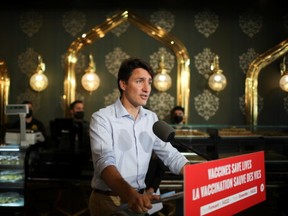 Canada's Prime Minister Justin Trudeau delivers a speech as he visits Nafisa Middle Eastern Cuisine restaurant during his election campaign tour in Mississauga on Aug. 27, 2021.