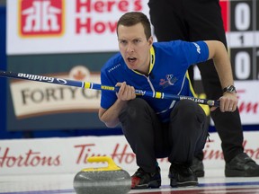 Alberta skip Brendan Bottcher  sits in the rings during the finals of the Tim Hortons Brier March 14, 2021 at WinSport Arena in Calgary.