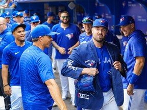 Blue Jays starter Robbie Ray dons the team's home run jacket in the dugout after coming out of the game against the Oakland Athletics in the seventh inning at the Rogers Centre on September 5, 2021.