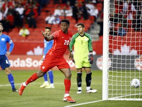 Jonathan David #20 of Canada celebrates a goal during a 2022 World Cup Qualifying match against El Salvador at BMO Field on September 8, 2021 in Toronto.