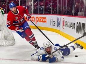 Joel Armia of the Montreal Canadiens is called for a tripping penalty on Mathieu Joseph of the Tampa Bay Lightning during the second period in Game Four of the 2021 NHL Stanley Cup Final at the Bell Centre on July 05, 2021 in Montreal, Quebec, Canada.