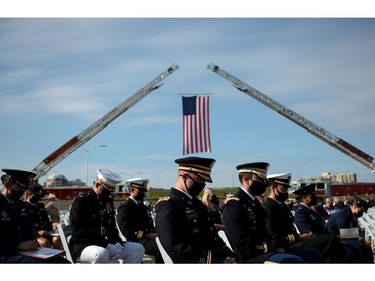 U.S. service members attend the Pentagon 9/11 observance ceremony at the National 9/11 Pentagon Memorial on Sept. 11, 2021 in Arlington, Va.