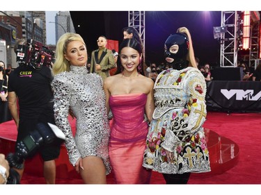 NEW YORK, NEW YORK - SEPTEMBER 12: (L-R) Paris Hilton, Olivia Rodrigo, and Kim Petras attend the 2021 MTV Video Music Awards at Barclays Center on September 12, 2021 in the Brooklyn borough of New York City.