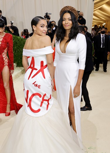 Alexandria Ocasio-Cortez (L) attends The 2021 Met Gala Celebrating In America: A Lexicon Of Fashion at Metropolitan Museum of Art on September 13, 2021 in New York City. (Photo by Mike Coppola/Getty Images)