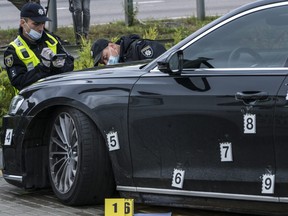 Police examine a car after an apparent assassination attempt against Serhiy Shefir, a top adviser to President Volodymyr Zelensky, on September 22, 2021 in Kyiv, Ukraine.