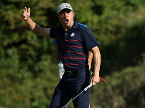 Team USA’s Justin Thomas reacts after holing his putt on the ninth green during the four-ball matches of the Ryder Cup at Whistling Straits in Kohler, Wisc., yesterday.