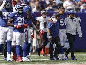 Blake Martinez #54 of the New York Giants walks off the field with an injury during the first quarter in the game against Atlanta Falcons at MetLife Stadium on September 26, 2021 in East Rutherford, New Jersey.