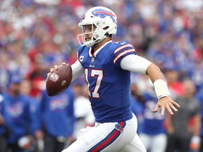 Josh Allen #17 of the Buffalo Bills runs the ball for a touchdown during the fourth quarter in the game against the Washington Football Team at Highmark Stadium on September 26, 2021 in Orchard Park, New York.