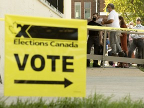 Elections Canada sign in front of a voting station.



Voters wait in line at an Elections Canada advance poll at St. Anthony District Meeting Centre, 10425 84 Ave., in Edmonton Friday Sept. 10, 2021. Photo by David Bloom