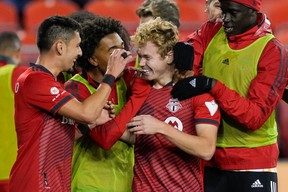 Toronto FC midfielder Marco Delgado (left) celebrates his second-half goal against FC Cincinnati on Wednesday night.