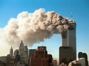 Smoke pours from the twin towers of the World Trade Center after they were hit by two hijacked airliners in a terrorist attack Sept. 11, 2001 in New York City.