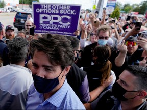 SENSITIVE MATERIAL. THIS IMAGE MAY OFFEND OR DISTURB    Protestors gesture towards Canada's Liberal Prime Minister Justin Trudeau at his election campaign tour stop in Brantford, Ontario, Canada September 6, 2021. REUTERS/Carlos Osorio