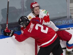 Canada's Braden Schneider (2) and Russia's Mikhail Abramov (back) battle during the world junior championship in January 2021 in Edmonton. Abramov was a fourth-round pick of the Maple Leafs in 2019.
