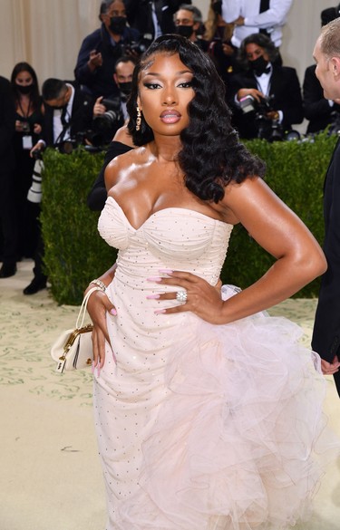 Rapper Megan Thee Stallion arrives for the 2021 Met Gala at the Metropolitan Museum of Art on September 13, 2021 in New York. - This year's Met Gala has a distinctively youthful imprint, hosted by singer Billie Eilish, actor Timothee Chalamet, poet Amanda Gorman and tennis star Naomi Osaka, none of them older than 25. The 2021 theme is "In America: A Lexicon of Fashion." (Photo by Angela WEISS / AFP) (Photo by ANGELA WEISS/AFP via Getty Images)