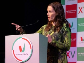 Icelandic Prime Minister Katrin Jakobsdottir talks to supporters of her Left Green Movement at a party event in Reykjavik on September 25, 2021 after the announcement of partial results in the country's general elections.