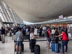 In this file photo passengers are seen at Dulles Washington International Airport (IAD) in Dulles, Virginia, on August 14, 2021.