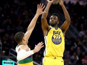 Warriors' Andrew Wiggins shoots over Josh Hart of the Pelicans at Chase Center in San Francisco, Feb. 23, 2020.