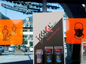 Signs are seen at the entrance of a lift station, as the coronavirus outbreak continues, in the Tyrolean ski resort of Ischgl, Austria, October 19, 2020.