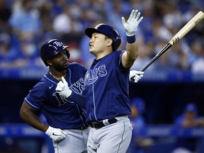 Ji-Man Choi of the Tampa Bay Rays celebrates with Randy Arozarena after hitting a solo home run against the Toronto Blue Jays at Rogers Centre on September 14, 2021 in Toronto.
