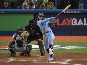 Blue Jays shortstop Bo Bichette hits a solo home run against New York Yankees in the third inning at Rogers Centre on Wednesday, Sept. 29, 2021.