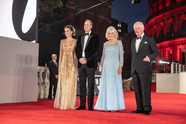 Britain's Prince Charles and Camilla, Duchess of Cornwall, Prince William and Catherine, Duchess of Cambridge, attend the world premiere of the new James Bond film "No Time To Die" at the Royal Albert Hall in London, England, Tuesday, Sept. 28, 2021.
