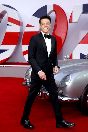 Rami Malek with James Bond's Aston Martin car at the World Premiere of "No Time To Die" at the Royal Albert Hall in London, England, Tuesday, Sept. 28, 2021.