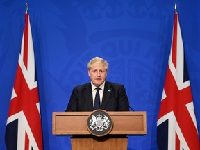 Britain's Prime Minister Boris Johnson speaks at a news conference in Downing Street, in London, Sept. 7, 2021.