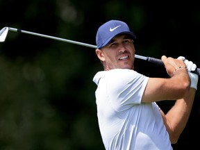 Brooks Koepka plays his shot from the second tee during the second round of the TOUR Championship at East Lake Golf Club on September 3, 2021 in Atlanta.