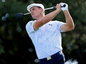 Bryson DeChambeau plays his shot from the 14th tee during the third round of the TOUR Championship at East Lake Golf Club on September 4, 2021 in Atlanta.