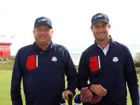 Harris English of team United States poses with caddie Eric Larson prior to the 43rd Ryder Cup.