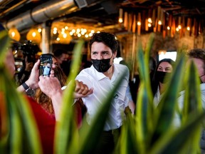 Prime Minister Justin Trudeau greets supporters during an election campaign stop at The Picaroons Roundhouse in Fredericton, New Brunswick, September 15, 2021.