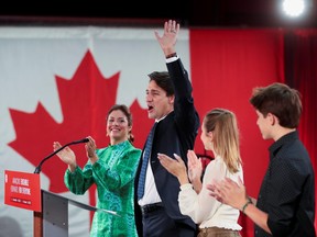 Liberal Prime Minister Justin Trudeau, accompanied by his wife Sophie Gregoire and their children Ella-Grace and Xavier, waves to supporters during the Liberal election night party in Montreal, Sept. 21, 2021.