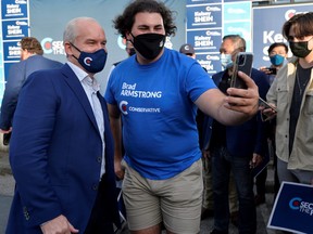 Conservative Party Leader Erin O'Toole poses for a selfie with a supporter at an election campaign visit to North Vancouver September 3, 2021.