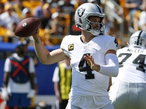 Entering Week 3, Raiders QB Derek Carr leads the NFL in pass yards (817, or 408.5 per game) and is tied for third in completions (62). Getty Images
