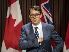 Ontario Labour Minister Monte McNaughton takes to the podium during a news conference in Toronto on April 28, 2021.