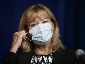 Ontario Minister of Health Christine Elliott removes her mask to speak at a press conference at Queen's Park in Toronto, Wednesday, Sept. 22, 2021.
