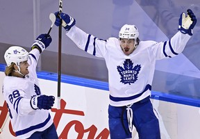 Toronto Maple Leafs’ Auston Matthews celebrates a game-winning goal with teammate William Nylander.