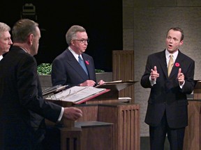 Canadian Alliance Leader Stockwell Day (right) debates with Liberal Leader Prime Minister Jean Chretien while Bloc Quebecois Leader Gilles Duceppe and Conservative Leader Joe Clark look on during the English leaders' debate in Ottawa, November 9, 2000.