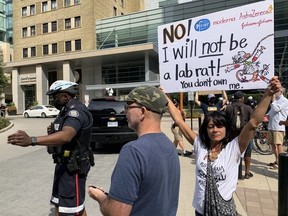 Anti-vax protesters drew criticism Monday when they converged on Toronto General Hospital on University Ave.