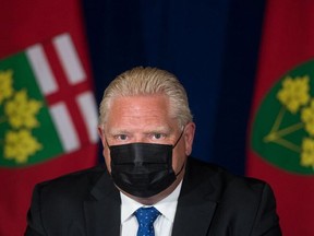 Ontario Premier Doug Ford listens to a question at a Sept. 1, 2021 press conference where he unveiled his government's plan for a vaccine passport.