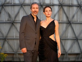 Director Denis Villeneuve and actor Rebecca Ferguson pose as they arrive for the premiere of Dune at the Toronto International Film Festival  on Sept. 11, 2021.