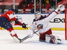 Goaltender Elvis Merzlikins of the Columbus Blue Jackets stops a shot by Frank Vatrano of the Florida Panthers at the BB&T Center on April 19, 2021 in Sunrise, Florida.