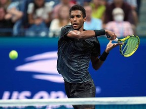 Felix Auger-Aliassime of Canada hits to Frances Tiafoe of the United States (not pictured) during the 2021 U.S. Open tennis tournament at USTA Billie Jean King National Tennis Center.