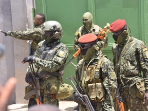 The Guinean Special Forces arrive at the Palace of the People in Conakry on Sept. 6, 2021, ahead of a meeting with the ministers of the Ex-President of Guinea, Alpha Conde.