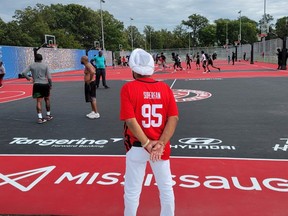 Raptors Superfan Nav Bhatia (centre) and Mayor Bonnie Crombie were on hand  at Mississauga's Paul Coffey Park on Saturday to officially open a new outdoor basketball facility.