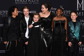 Angelina Jolie (C) and children (from L) Pax Thien Jolie-Pitt, Shiloh Nouvel Jolie-Pitt, Vivienne Marcheline Jolie-Pitt, Zahara Marley Jolie-Pitt, and Knox Leon Jolie-Pitt arrive for the world premiere of Disney’s “Maleficent: Mistress of Evil” at the El Capitan Theatre in Hollywood on Sept. 30, 2019.