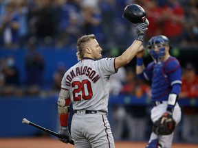 Ex-Blue Jay Josh Donaldson, now of the Minnesota Twins, salutes the crowd during the first inning of their MLB game at the Rogers Centre on September 17, 2021 in Toronto, Ontario.