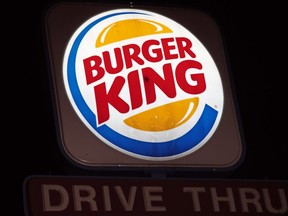 An illuminated Burger King sign.